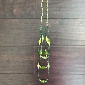 Very long green necklace with bead charms